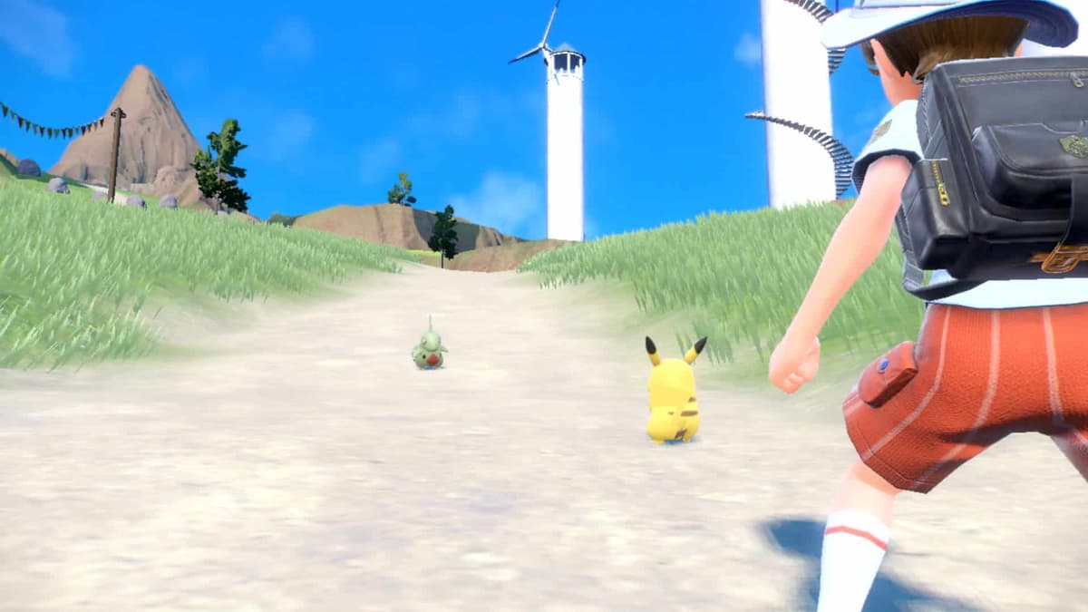 Captura de pantalla de la batalla entre Pokémon Scarlet y Violet Pikachu vs Larvitar.